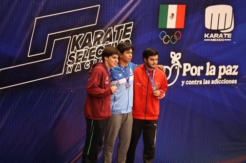 Three karate athletes on a medal podium wearing red and blue jackets at a Karate Series event